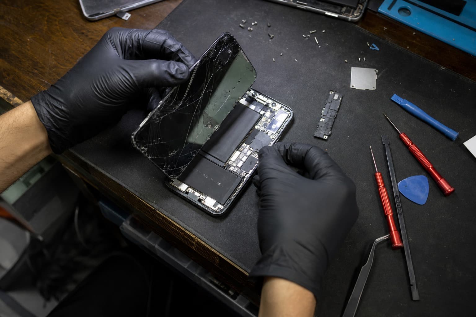 Phone repair in progress on the SPR workbench